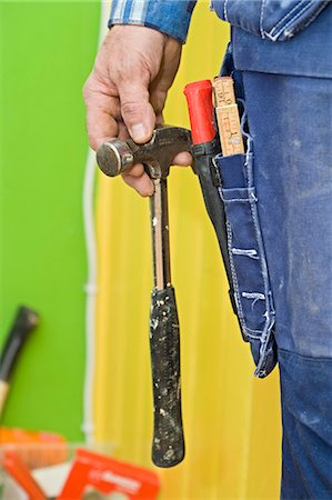 simsearch:6102-07158067,k - A craftsman holding a hammer, close-up, Sweden. Stock Photo - Premium Royalty-Free, Code: 6102-03826962
