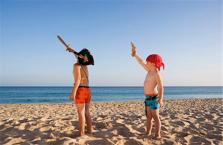 pirate - Children playing on the beach. Stock Photo - Premium Royalty-Free, Code: 6102-03827205