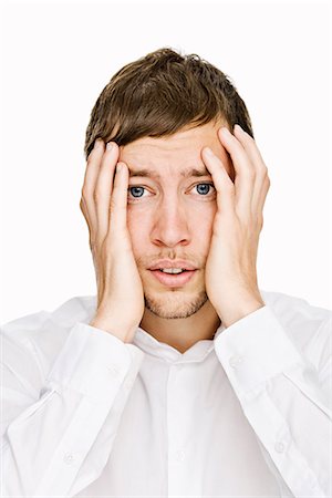 A man in a white shirt thinking, Sweden. Stock Photo - Premium Royalty-Free, Code: 6102-03827566