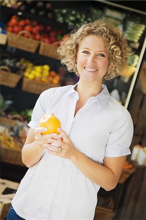 purchase groceries - A woman buying food, Sweden. Stock Photo - Premium Royalty-Free, Code: 6102-03827702