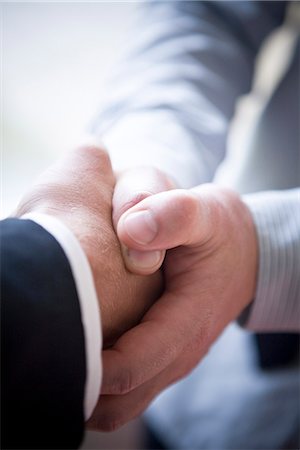 A handshake, close-up, Sweden. Stock Photo - Premium Royalty-Free, Code: 6102-03828364