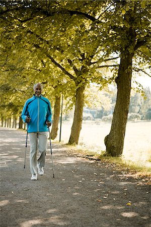 Senior man walking in a park, Sweden. Stock Photo - Premium Royalty-Free, Code: 6102-03828563