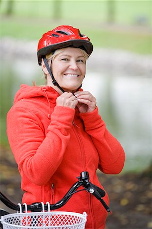 A woman on a bicycle, Sweden. Stock Photo - Premium Royalty-Free, Code: 6102-03828505