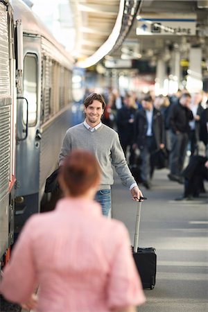 people waiting at train station - A couple on a train station, Stockholm, Sweden. Stock Photo - Premium Royalty-Free, Code: 6102-03828695