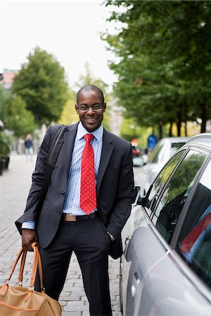 simsearch:6102-07455789,k - A businessman carrying a bag, Sweden. Stock Photo - Premium Royalty-Free, Code: 6102-03828731