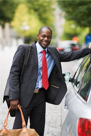 simsearch:6102-07455789,k - A businessman standing by a car, Stockholm, Sweden. Stock Photo - Premium Royalty-Free, Code: 6102-03828732