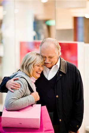 simsearch:6102-06025962,k - Senior couple carrying shopping bags, Stockholm, Sweden. Stock Photo - Premium Royalty-Free, Code: 6102-03829144