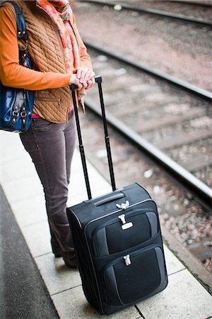 people waiting at train station - A woman at a railway station, Sweden. Stock Photo - Premium Royalty-Free, Code: 6102-03829116