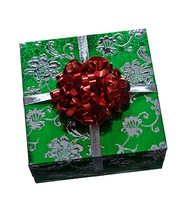 present wrapped close up - A wrapped gift against a white background. Stock Photo - Premium Royalty-Free, Code: 6102-03904155
