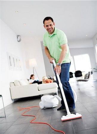A man vacuuming a floor, Sweden. Foto de stock - Sin royalties Premium, Código: 6102-03904110
