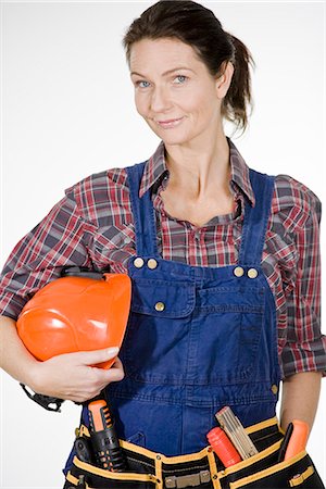 A building worker with a hard hat. Stock Photo - Premium Royalty-Free, Code: 6102-03904522