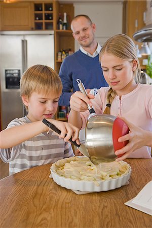 simsearch:846-02794589,k - Sister and brother making a pie with their father, Sweden. Stock Photo - Premium Royalty-Free, Code: 6102-03904679