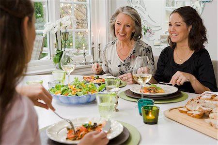 family meal grandparents - Grandmother, mother and daughter at dinner table, Sweden. Stock Photo - Premium Royalty-Free, Code: 6102-03904767