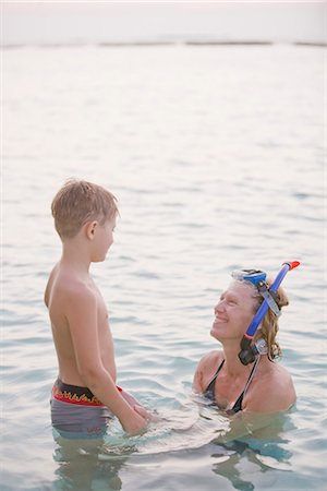 Mother and son bathing in the sea, the Maldives. Stock Photo - Premium Royalty-Free, Code: 6102-03904798