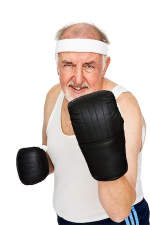 Senior man with boxing gloves. Stock Photo - Premium Royalty-Free, Code: 6102-03904860