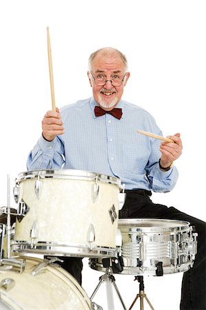 drum - Senior man playing the drums. Stock Photo - Premium Royalty-Free, Code: 6102-03904877