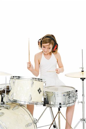 drum (instrument) - A girl playing music. Stock Photo - Premium Royalty-Free, Code: 6102-03904900