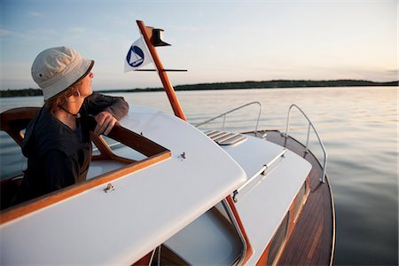 Woman travelling in boat Stock Photo - Premium Royalty-Free, Code: 6102-03905732