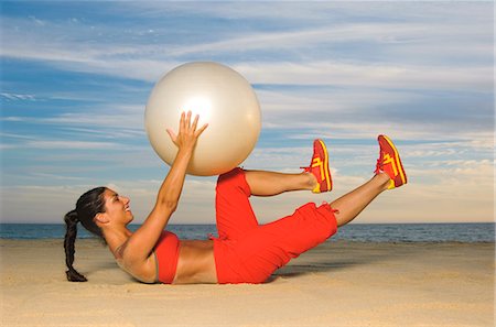 forcefully - Woman exercising with fitness ball Stock Photo - Premium Royalty-Free, Code: 6102-03905736