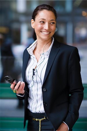 simsearch:6102-07455789,k - Cheerful businesswoman with mobile phone Stock Photo - Premium Royalty-Free, Code: 6102-04929594