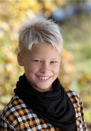 sweden blond boy - Portrait of blonde boy smiling outside Stock Photo - Premium Royalty-Free, Code: 6102-05802526