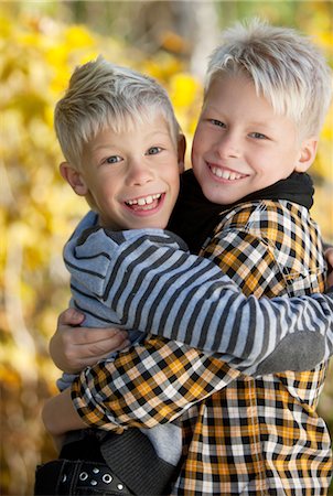 sweden blond boy - Portrait of two blonde boys hugging outside Stock Photo - Premium Royalty-Free, Code: 6102-05802528