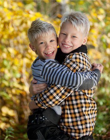 sweden blond boy - Portrait of two blonde boys hugging outside Stock Photo - Premium Royalty-Free, Code: 6102-05802529