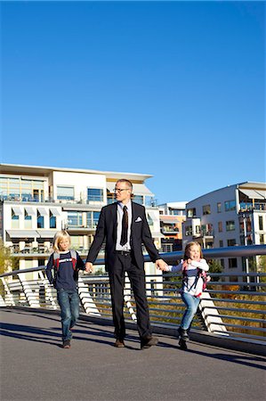 fetch - Father and children walking on footbridge Stock Photo - Premium Royalty-Free, Code: 6102-06025765