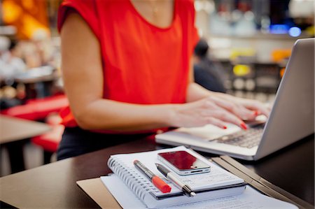 person on office desk phone - Woman working with laptop Stock Photo - Premium Royalty-Free, Code: 6102-06025912