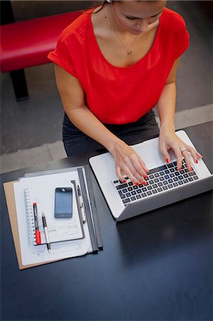 person organizing desk - Woman working with laptop Stock Photo - Premium Royalty-Free, Code: 6102-06025914