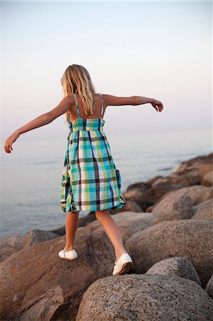 summer vacation - Girl walking on rocks Stock Photo - Premium Royalty-Free, Code: 6102-06336562