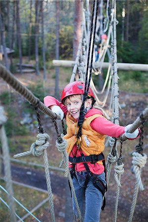 Girl on rope bridge, portrait Stock Photo - Premium Royalty-Free, Code: 6102-06336571