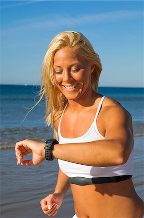 A blond woman running on a beach, Portugal. Stock Photo - Premium Royalty-Free, Code: 6102-06470730