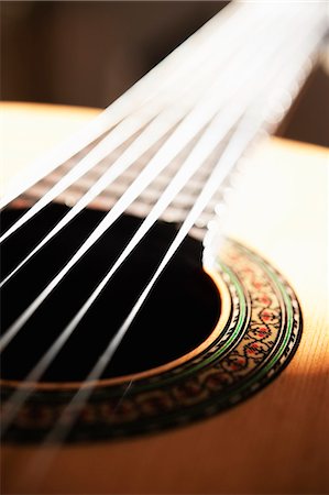 Close-up of acoustic guitar Stock Photo - Premium Royalty-Free, Code: 6102-06470977
