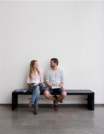 Young students sitting on bench Stock Photo - Premium Royalty-Free, Code: 6102-06471220