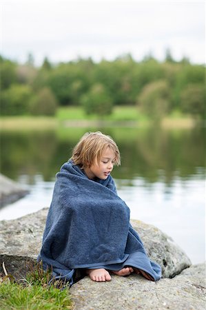 sweden blond boy - Portrait of boy wrapped in towel sitting by lake Stock Photo - Premium Royalty-Free, Code: 6102-06777405