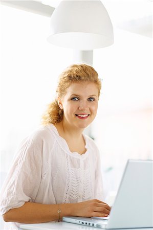 people home office not shopping - Young woman working on laptop Stock Photo - Premium Royalty-Free, Code: 6102-06777544