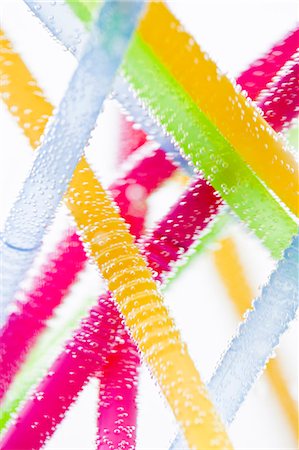 Studio shot of colorful drinking straws in water Stock Photo - Premium Royalty-Free, Code: 6102-06777582