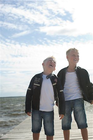 simsearch:6102-06965474,k - Two boys on jetty Stock Photo - Premium Royalty-Free, Code: 6102-06965574