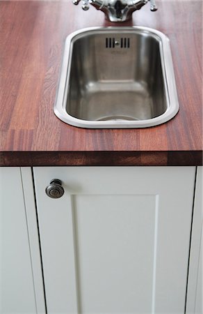 Sink in kitchen island Stock Photo - Premium Royalty-Free, Code: 6102-06965671