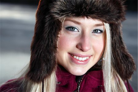 simsearch:6102-06965505,k - Portrait of young woman wearing fur hat Stock Photo - Premium Royalty-Free, Code: 6102-06965688