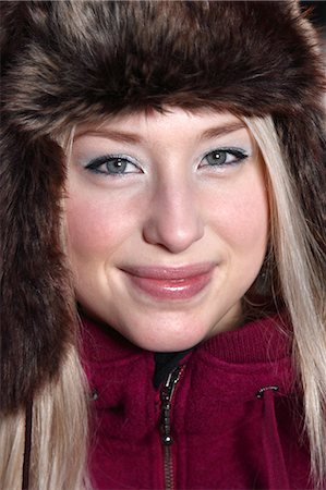 simsearch:6102-06965505,k - Portrait of young woman wearing fur hat Stock Photo - Premium Royalty-Free, Code: 6102-06965689