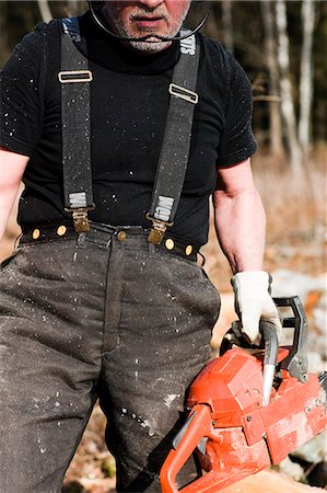 sawing - Senior man with chainsaw Stock Photo - Premium Royalty-Free, Code: 6102-06965627