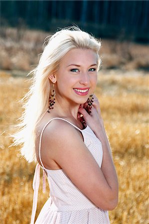 simsearch:6102-06965474,k - Portrait of smiling young woman Stock Photo - Premium Royalty-Free, Code: 6102-06965764