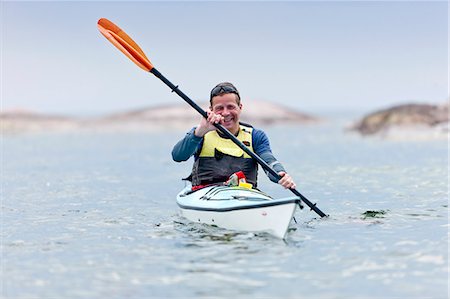 simsearch:6102-06965474,k - Man paddling Stock Photo - Premium Royalty-Free, Code: 6102-06965703