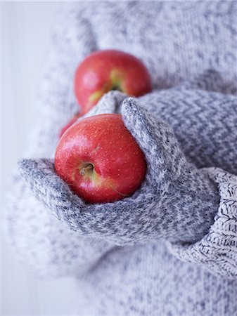 simsearch:6102-07157973,k - Childs hands in gloves holding red apples Stock Photo - Premium Royalty-Free, Code: 6102-07158088