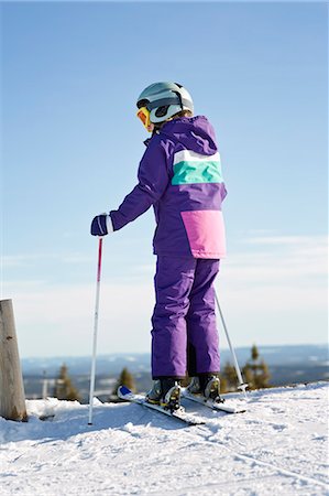 simsearch:6102-07158155,k - Girl skiing, rear view Stock Photo - Premium Royalty-Free, Code: 6102-07158159