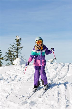 simsearch:6102-07158155,k - Girl skiing, low angle view Stock Photo - Premium Royalty-Free, Code: 6102-07158160