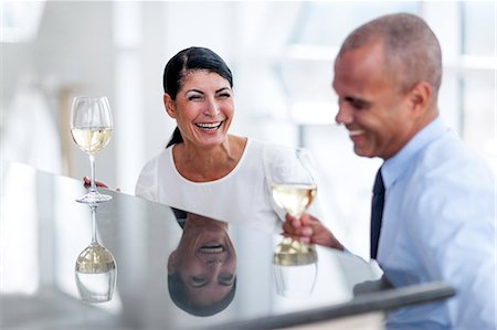 flirting - Man and woman drinking wine and talking Stock Photo - Premium Royalty-Free, Code: 6102-07158235