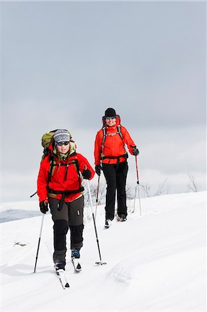 simsearch:6102-07158155,k - Two women doing cross country skiing, Ammarnas, Lapland, Sweden Stock Photo - Premium Royalty-Free, Code: 6102-07455799
